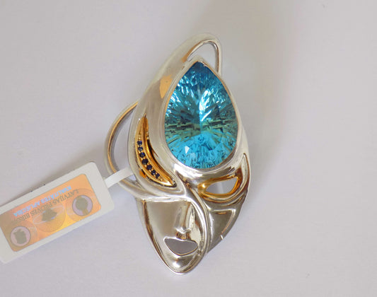 Silver Mask Pendant with Blue Topaz and Blue Sapphires