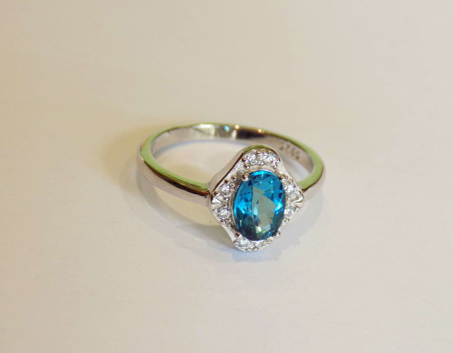 Silver Ring with London Blue Topaz and Zircons