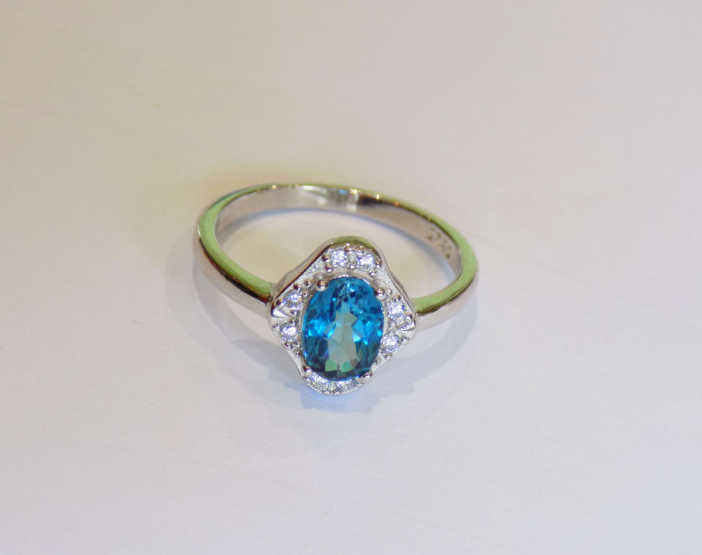 Silver Ring with London Blue Topaz and Zircons