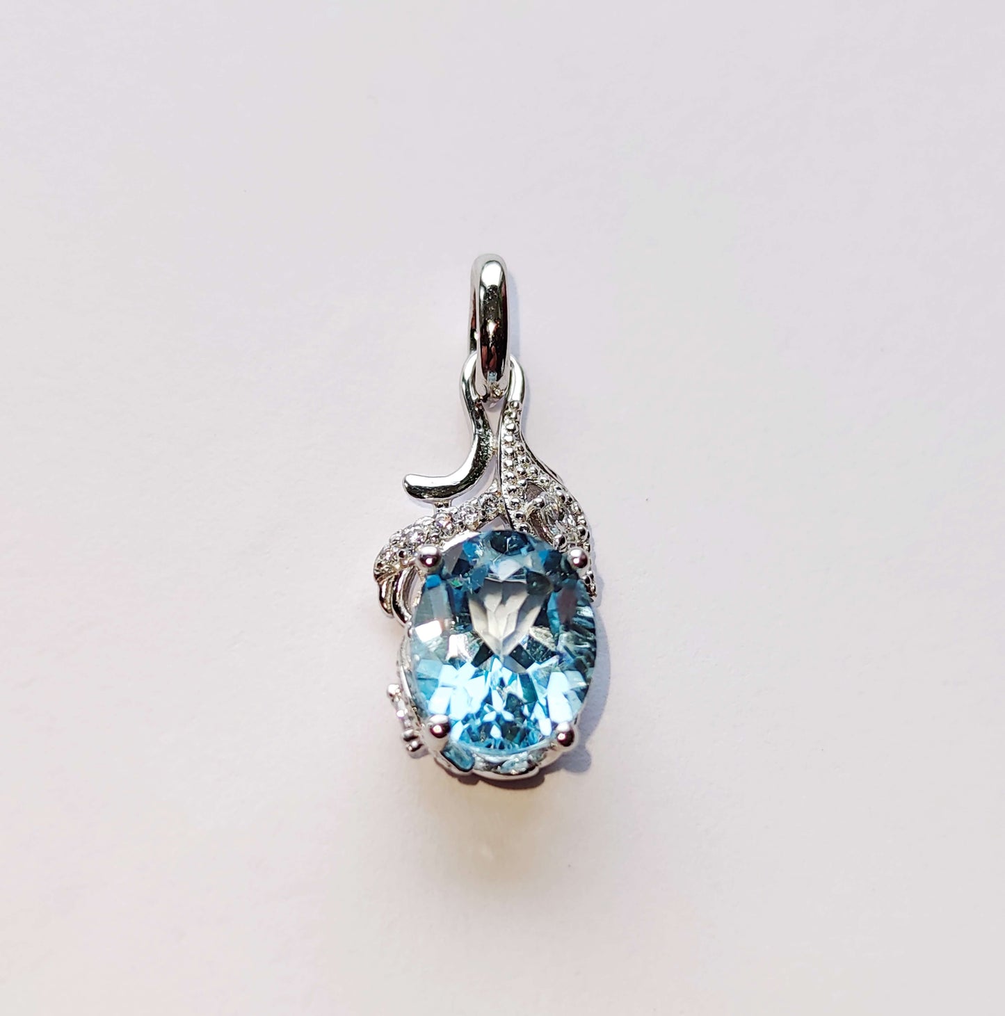 Серебряное кольцо с голубым Топазом и Цирконами