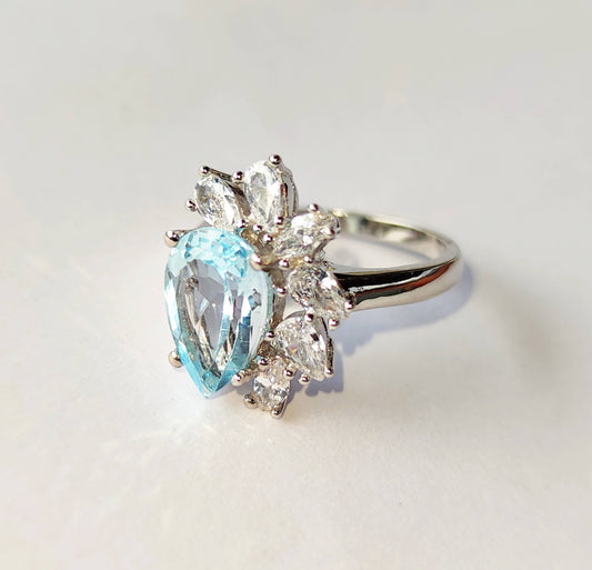 Silver Ring with Blue Topaz and Zircons