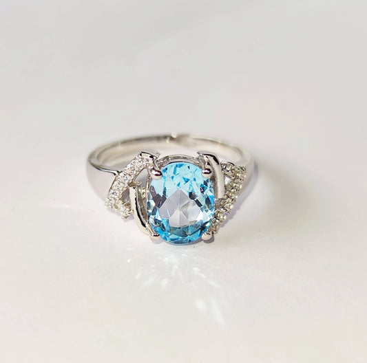 Silver Ring with Blue Topaz and Zircons