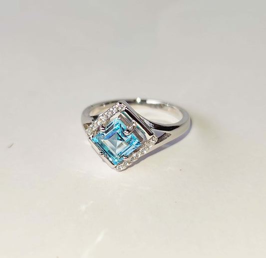 Silver Ring with Blue Topaz and Zircons