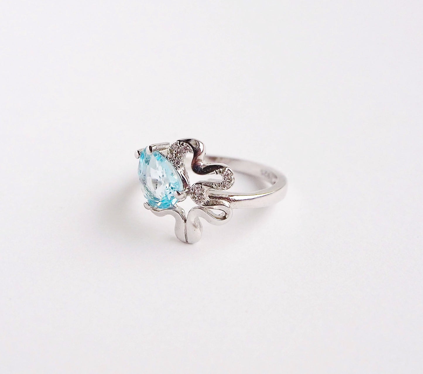 Silver Ring with Blue Topaz and Zircons