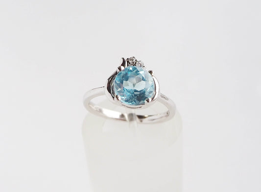 Silver Ring with Blue Topaz and Zircons